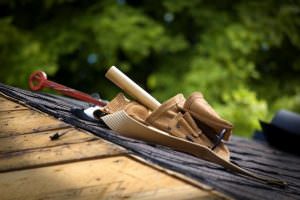Tools on a roof. Roofer is either going to repair or replace roof. 